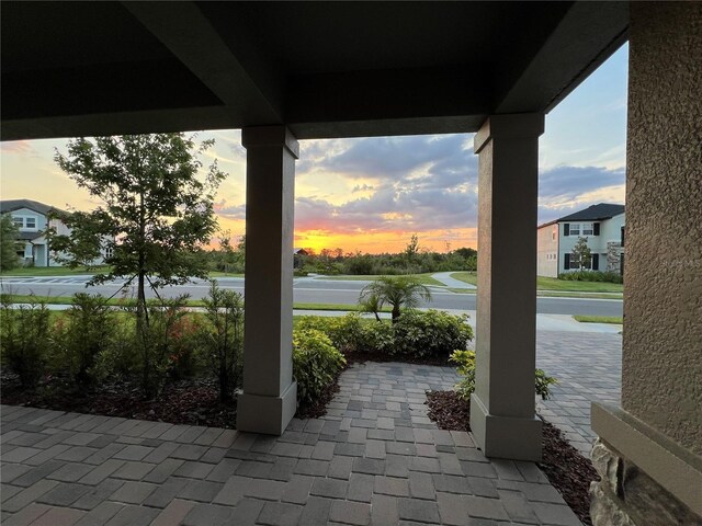 view of patio terrace at dusk