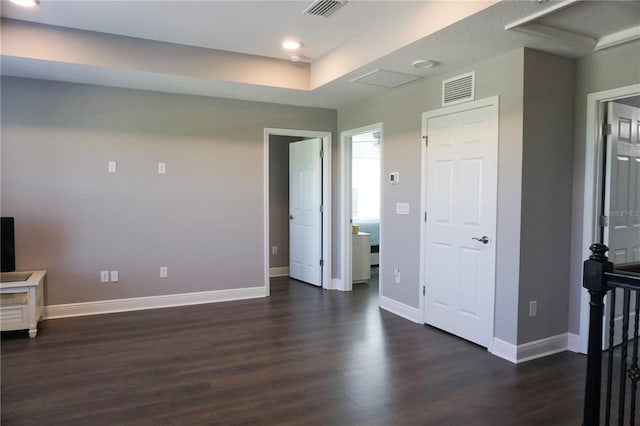 interior space with visible vents, recessed lighting, baseboards, and dark wood-style flooring