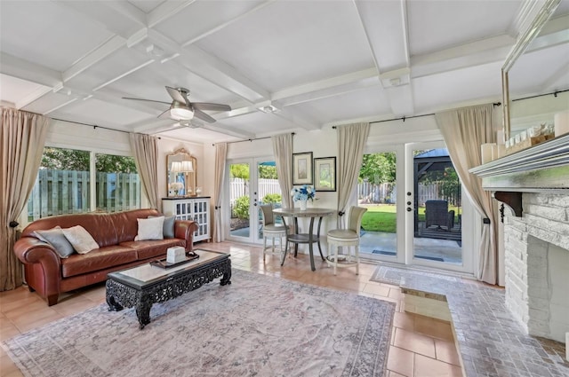 sunroom / solarium with coffered ceiling, a ceiling fan, french doors, a brick fireplace, and beam ceiling