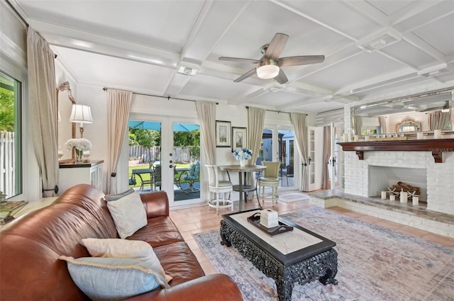 sunroom featuring french doors, beamed ceiling, coffered ceiling, and a fireplace