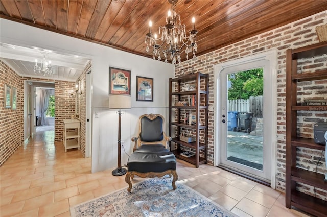 sitting room with a wealth of natural light, wood ceiling, brick wall, and an inviting chandelier