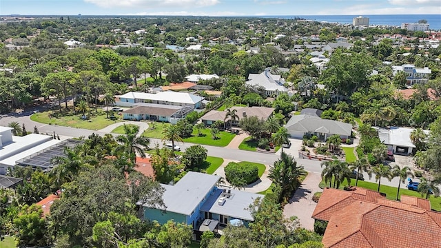 drone / aerial view with a residential view and a water view