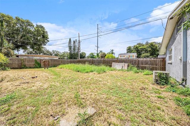 view of yard featuring central AC unit