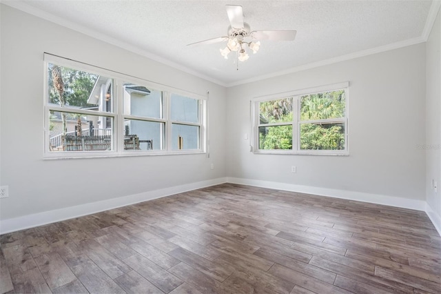 empty room featuring a textured ceiling, crown molding, ceiling fan, and hardwood / wood-style flooring