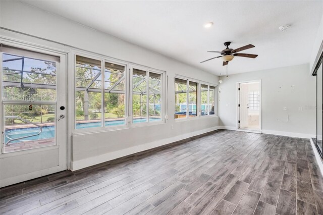 interior space with ceiling fan and hardwood / wood-style flooring