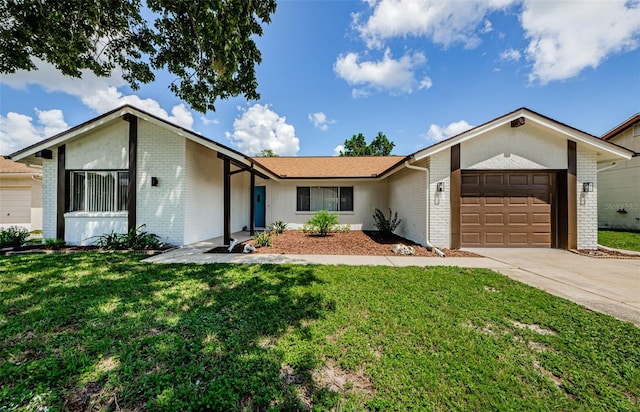 ranch-style home featuring a garage, brick siding, driveway, and a front lawn