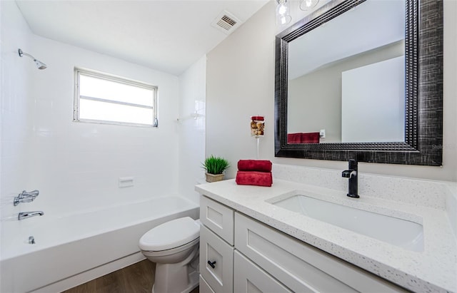 full bathroom with toilet, vanity, wood-type flooring, and  shower combination