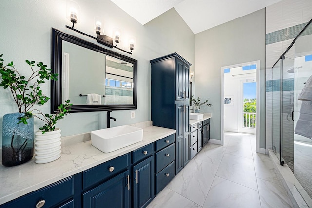 bathroom featuring vanity, a healthy amount of sunlight, and an enclosed shower