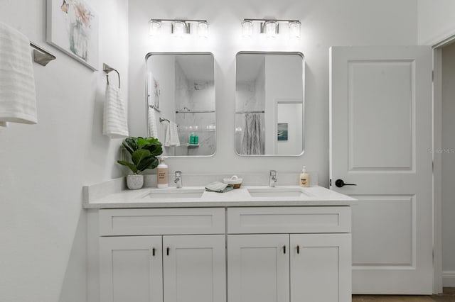 bathroom featuring vanity and a shower with shower curtain