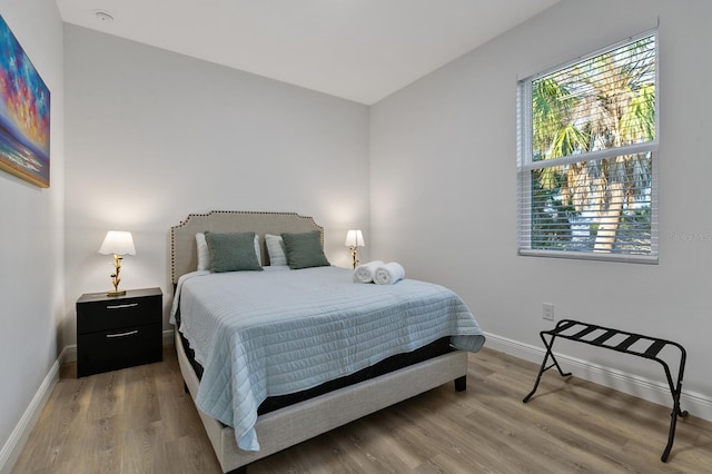 bedroom featuring wood-type flooring