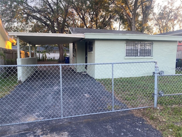 view of side of property featuring a carport