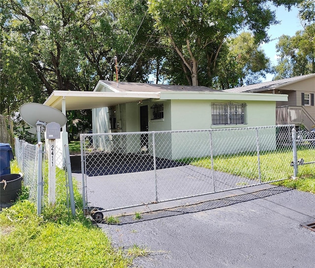 view of front facade with a carport