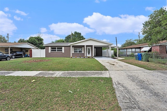 view of front facade with a carport and a front lawn