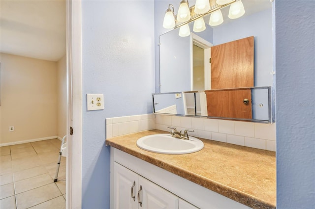 bathroom with vanity, tile patterned floors, and tasteful backsplash