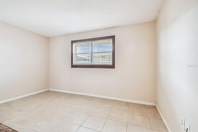 unfurnished room with light tile patterned floors