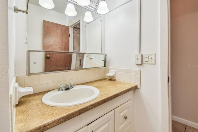 bathroom with vanity and backsplash