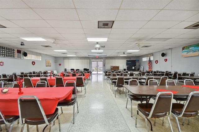 dining space featuring a paneled ceiling and ceiling fan