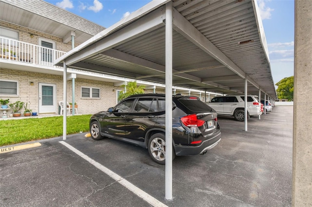 view of parking / parking lot featuring a carport