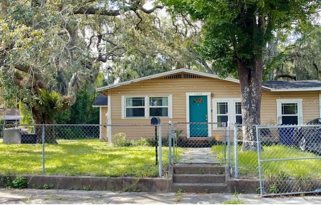 view of front of property with a front lawn