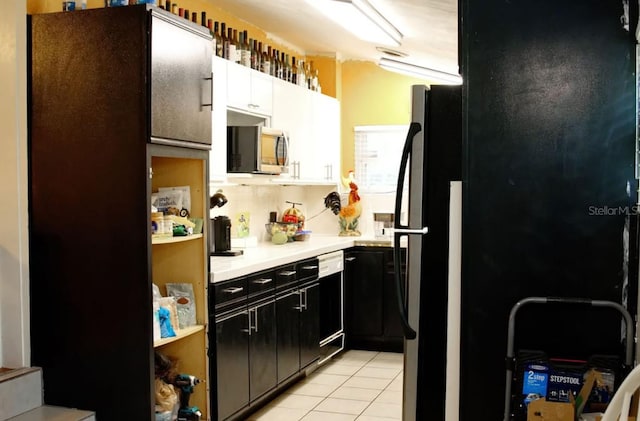 kitchen featuring black appliances and light tile patterned flooring