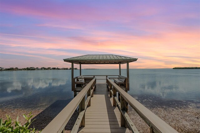 dock area with a gazebo and a water view