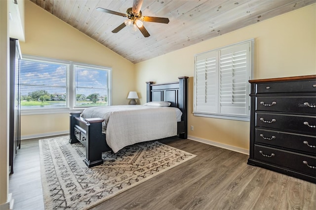 bedroom with wooden ceiling, dark hardwood / wood-style flooring, ceiling fan, and lofted ceiling