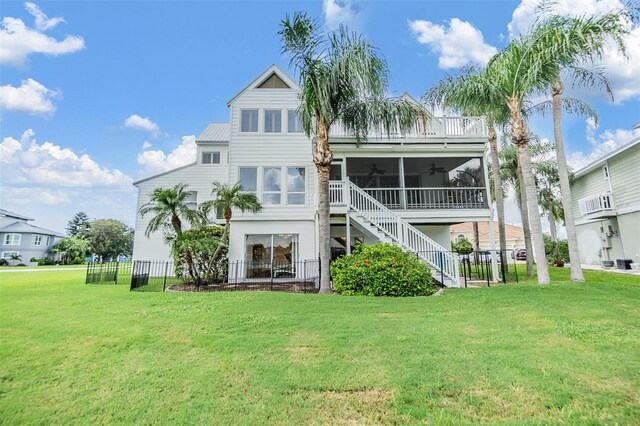 2118 Harbour Watch Dr, Tarpon Springs, FL 34689 - back of property featuring a ceiling fan, stairs, a sunroom, and metal roof