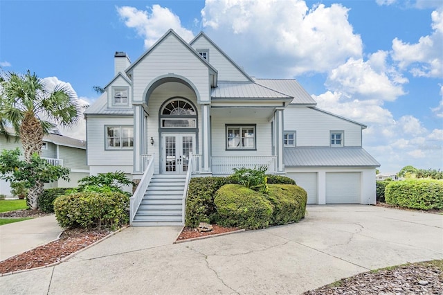 view of front of house featuring a garage and a porch