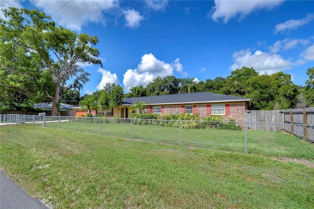 single story home featuring a front yard and a fenced backyard