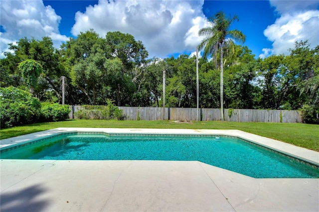 view of swimming pool with a fenced in pool, a fenced backyard, and a yard