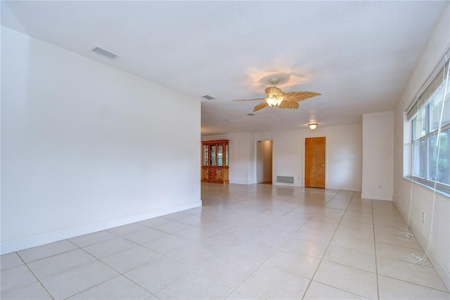 unfurnished room featuring light tile patterned flooring and ceiling fan