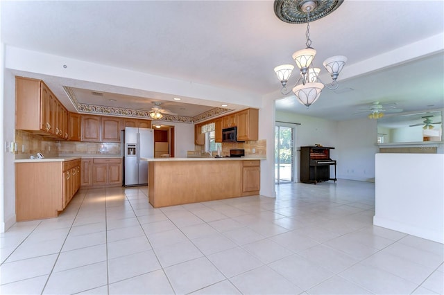 kitchen featuring backsplash, light tile patterned floors, ceiling fan with notable chandelier, kitchen peninsula, and stainless steel refrigerator with ice dispenser