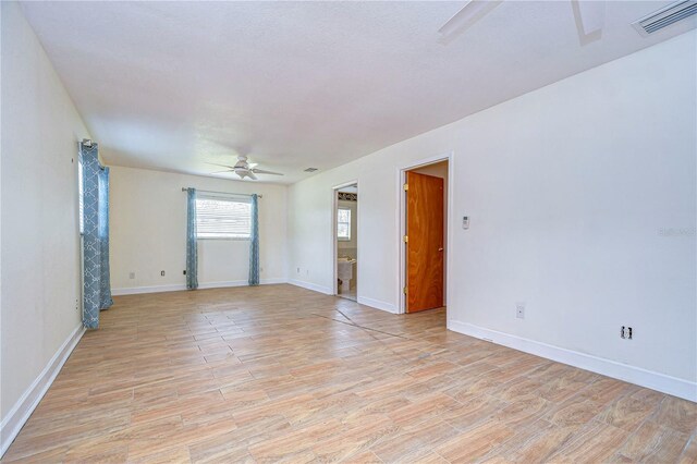 spare room with ceiling fan and light hardwood / wood-style flooring