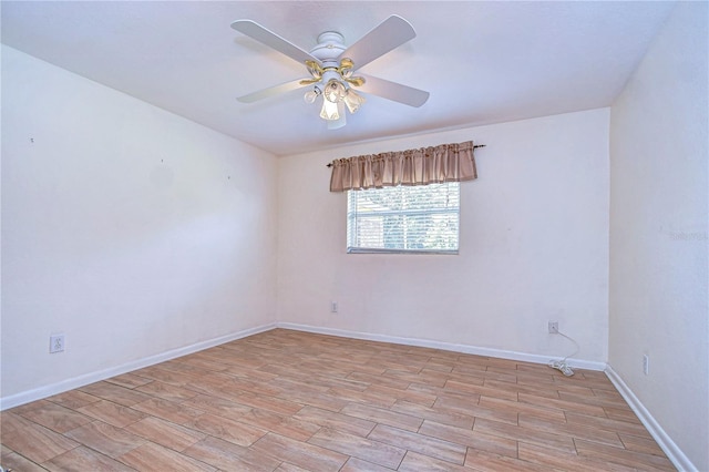 spare room with ceiling fan and light hardwood / wood-style flooring