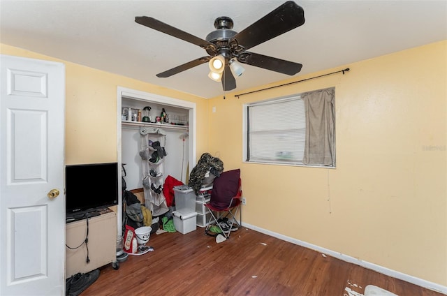 interior space with hardwood / wood-style floors and ceiling fan