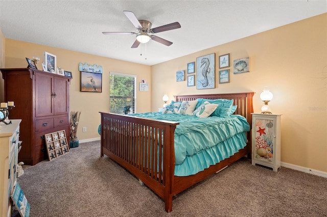 carpeted bedroom with ceiling fan and a textured ceiling