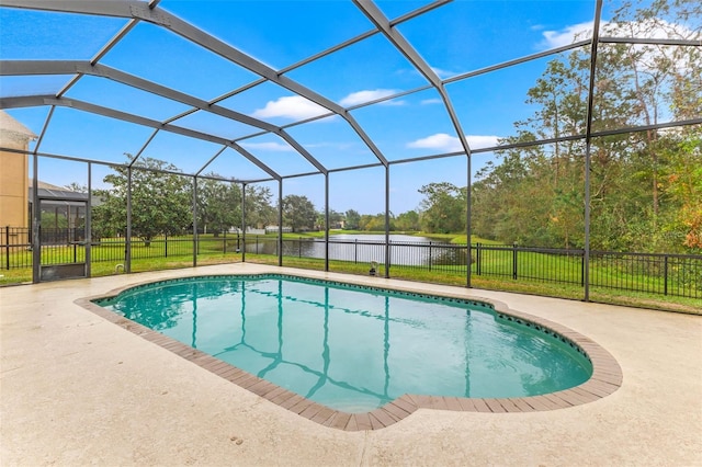 view of swimming pool featuring a lawn, a patio area, and a lanai