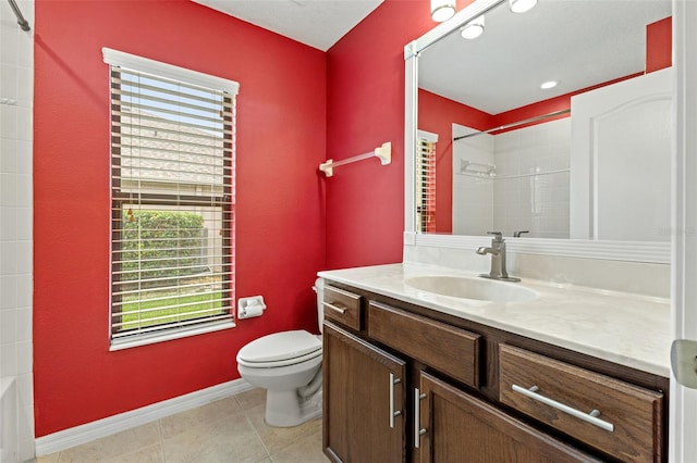 bathroom with tile patterned flooring, vanity, and toilet