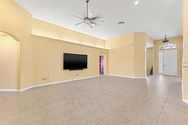 unfurnished living room with light tile patterned floors and ceiling fan