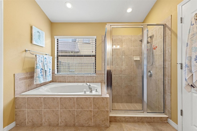 bathroom featuring tile patterned floors and separate shower and tub