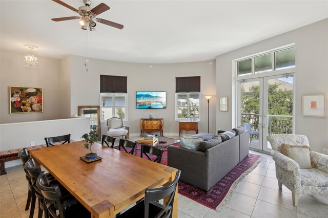 dining room with baseboards, light tile patterned flooring, ceiling fan, and french doors