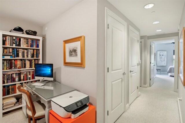 home office with light carpet and recessed lighting