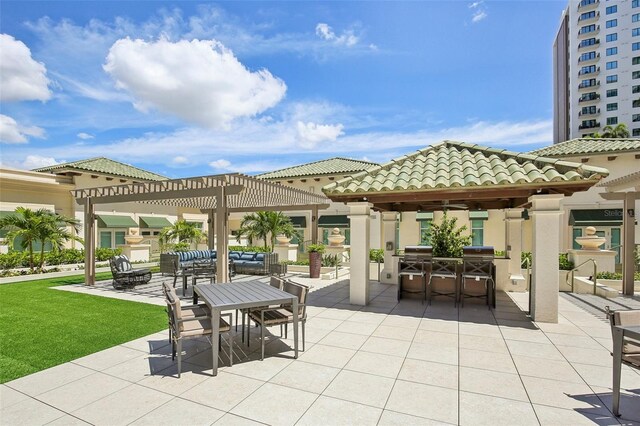 view of patio / terrace featuring grilling area, outdoor dining area, a pergola, and area for grilling