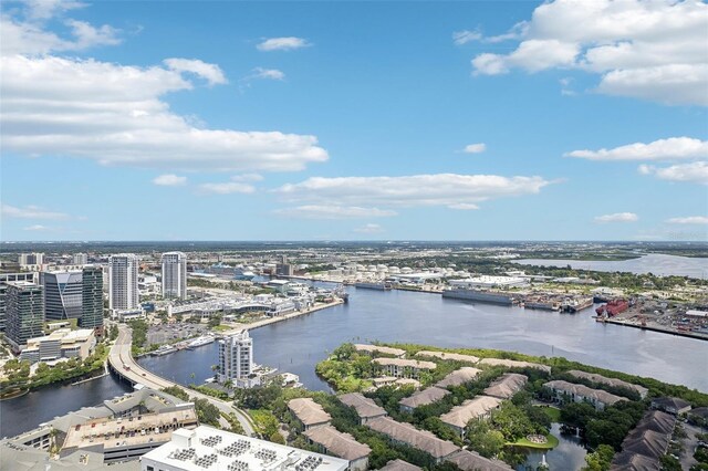 birds eye view of property featuring a view of city and a water view