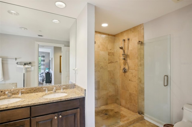 450 Knights Run Ave Unit 411, Tampa, FL 33602 - full bathroom with a stall shower, double vanity, toilet, and recessed lighting