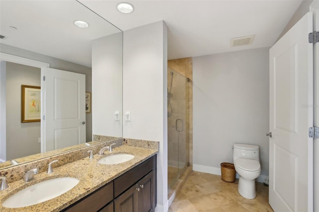 450 Knights Run Ave Unit 411, Tampa, FL 33602 - bathroom featuring toilet, double vanity, a stall shower, baseboards, and recessed lighting