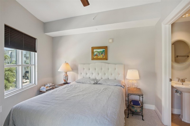 bedroom with baseboards and carpet flooring