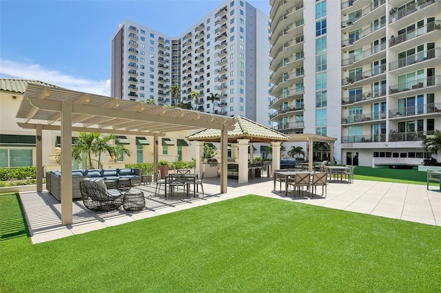 view of property's community with a patio, a lawn, an outdoor living space, and a pergola