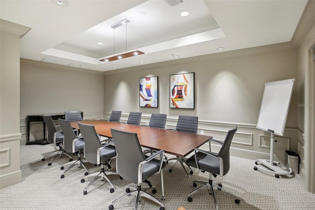 carpeted office space with a tray ceiling, a wainscoted wall, a decorative wall, and recessed lighting