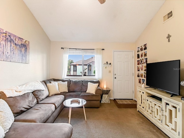 living room with lofted ceiling and carpet flooring